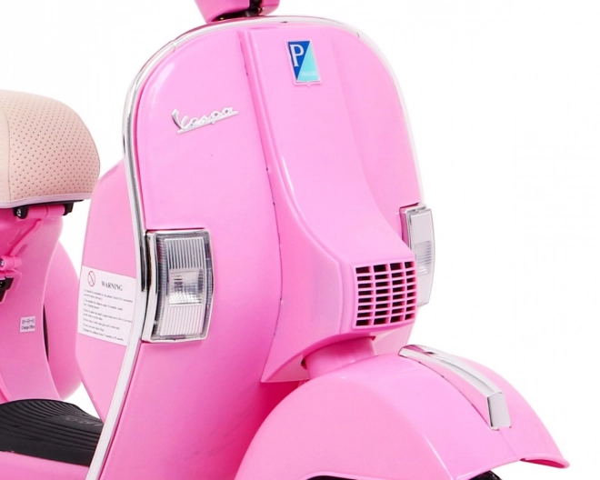 Elektrische kinderscooter Vespa roze met zijwieltjes
