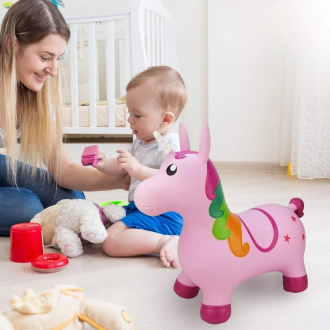 Springende roze eenhoorn Woopie met pomp