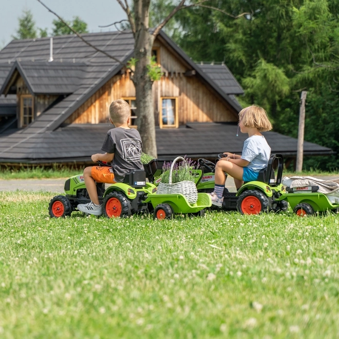 Trappertractor Claas Arion 410 met groene aanhanger