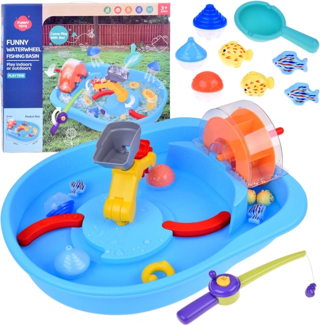 Blauwe watertafel met waterrad en visaccessoires