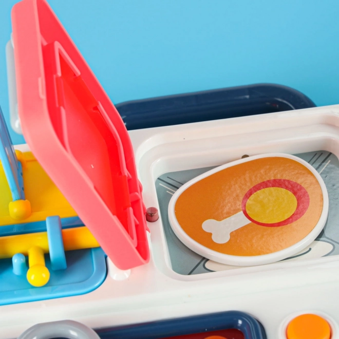 Montessori manipulatiebord met keukenelementen en leermatige klok