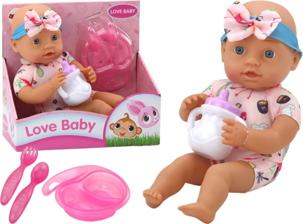 Stoffen babypop met roze outfit met flamingo’s en voederset