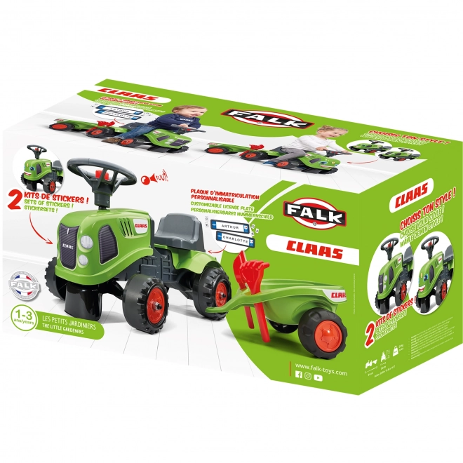 Duwtractor Claas groen met stuur en aanhanger