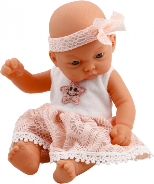 Babypop in roze jurk met haarband