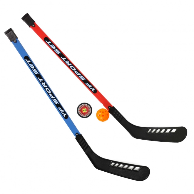 Hockeysticks met bal en puck