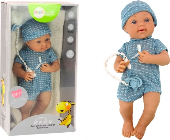 Babypop in blauw outfit met mutsje en speen