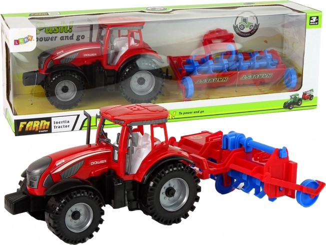 Rode tractor met ploeg met frictie-aandrijving
