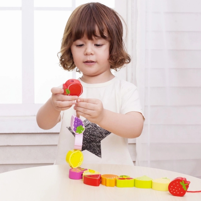 Houten rijgblokken met fruit