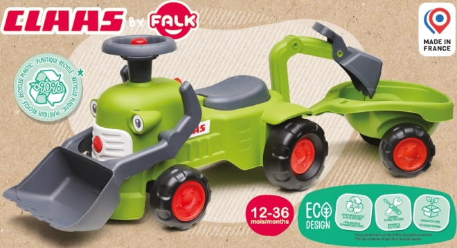 Rijdende tractor Claas met aanhanger, lader en schep
