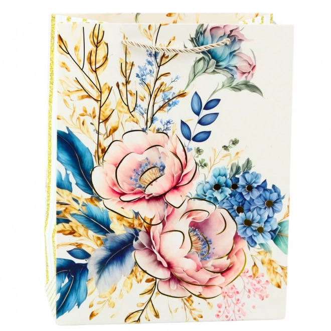 Cadeautas met bloemen en gouden accenten