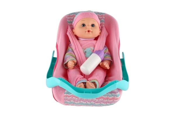 Poppen baby 30 cm plastic in draagzak/autostoeltje met flesje in blister