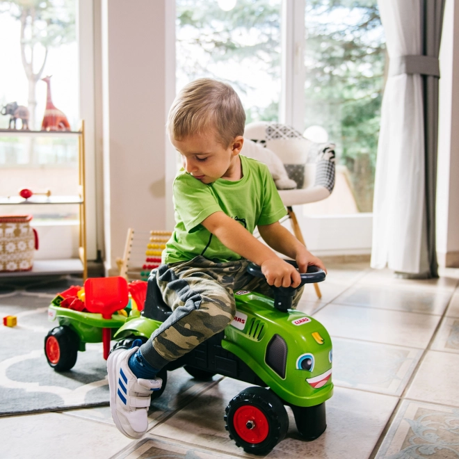Duwtractor Claas groen met stuur en aanhanger