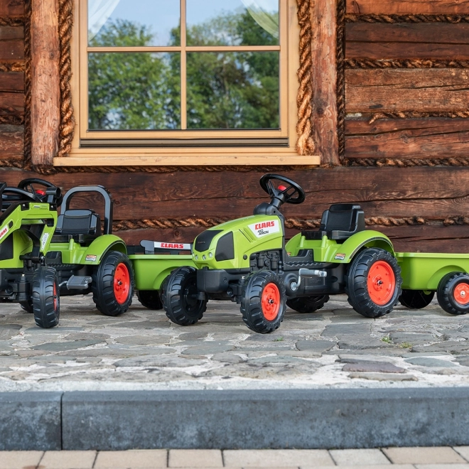 Trappertractor Claas Arion 410 met groene aanhanger