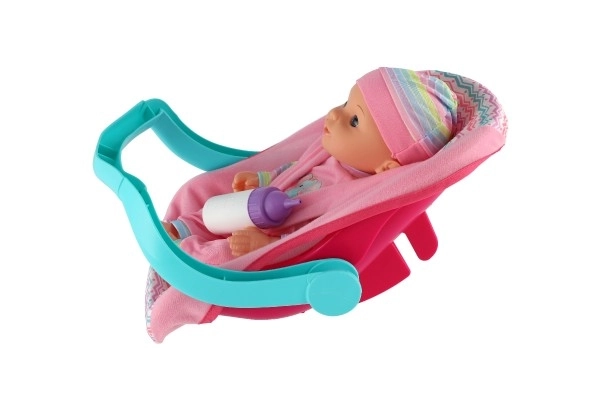 Poppen baby 30 cm plastic in draagzak/autostoeltje met flesje in blister