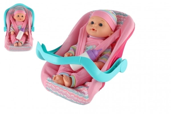 Poppen baby 30 cm plastic in draagzak/autostoeltje met flesje in blister