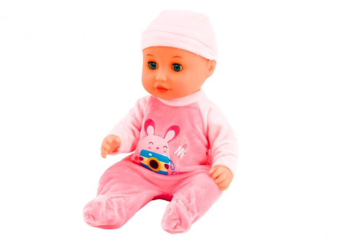Baby pop met roze kleding en geluidseffecten