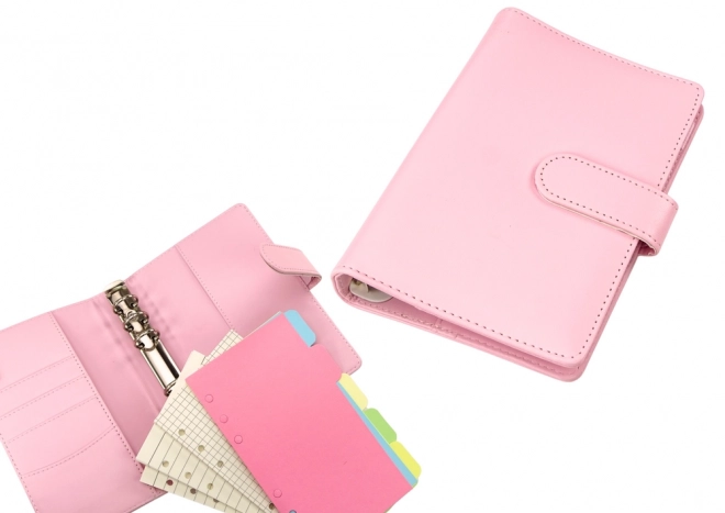 Roze notitieboek met accessoires en leren design