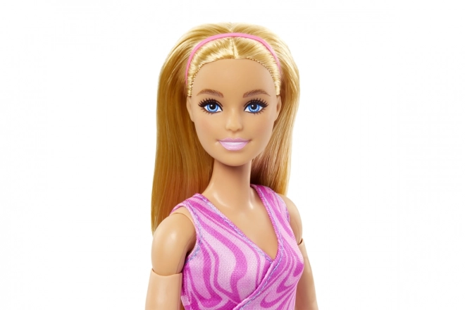 Barbie in beweging - Blondine met blauwe legging HRH27