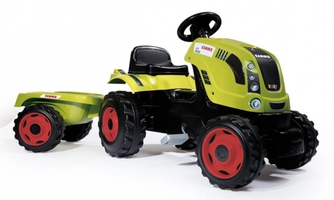 Tractor op trappers CLAAS Arion 400 met aanhangwagen groen