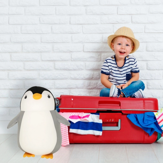 Reiskussen 2-in-1 in de vorm van een croissant en pluche pinguïn