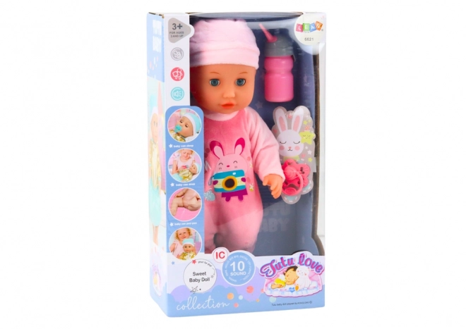 Baby pop met roze kleding en geluidseffecten