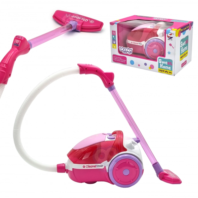 Roze kinderstofzuiger met zuigfunctie