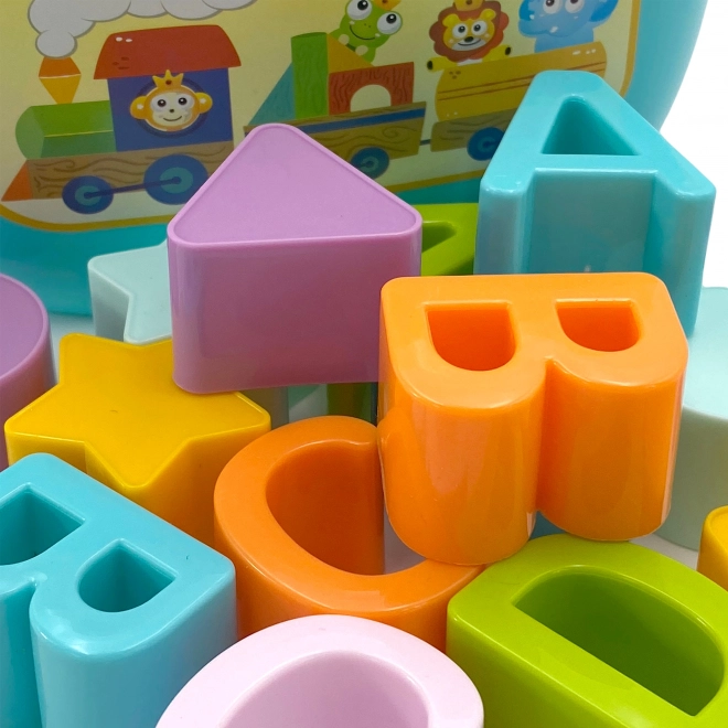 Woopie kindersorteerder en koffertje met het leren van het alfabet en vormen
