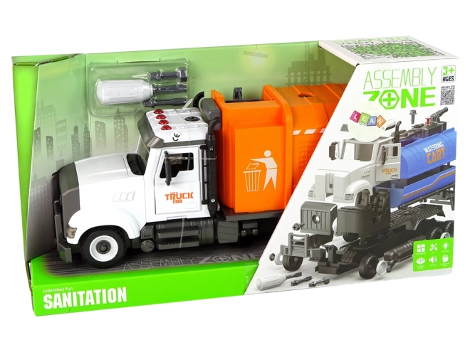 Oranje afvalwagen met schroef- en draaibare accessoirekit