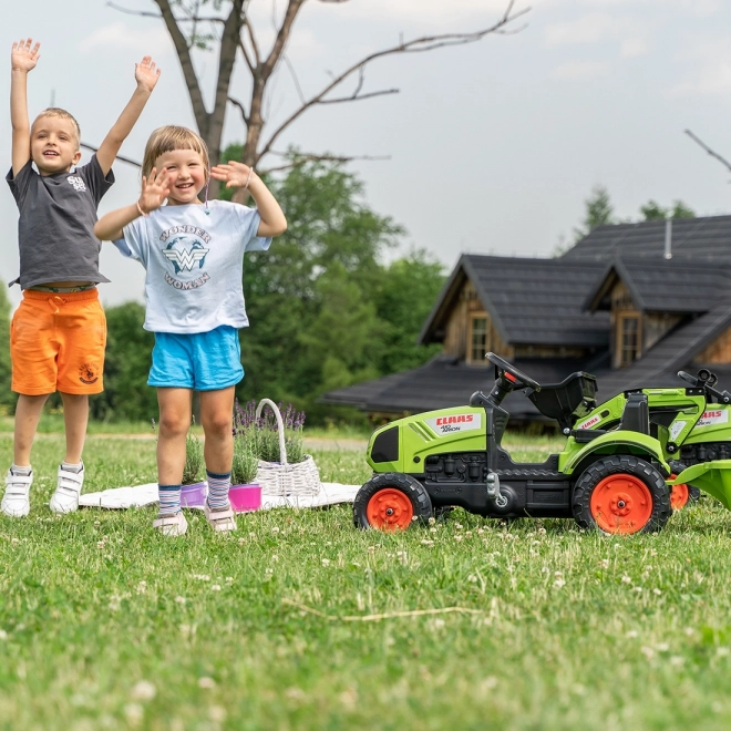 Trappertractor Claas Arion 410 met groene aanhanger