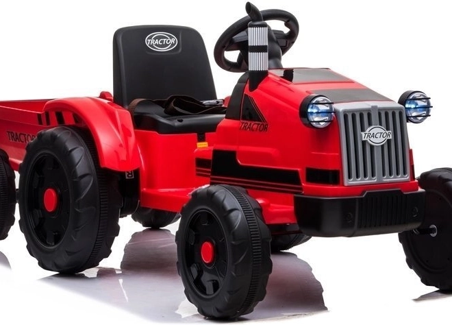 Elektrische tractor met aanhangwagen rood