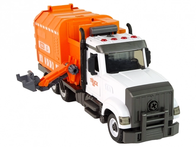 Oranje afvalwagen met schroef- en draaibare accessoirekit