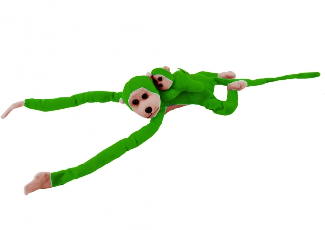 Pluchen aap met groene jong
