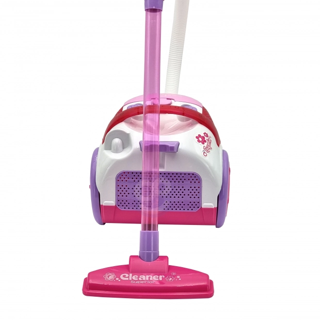 Roze kinderstofzuiger met zuigfunctie