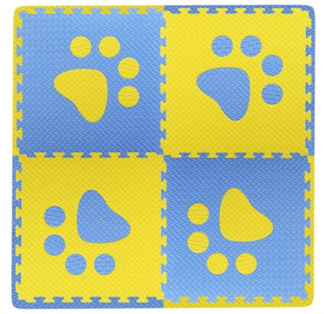 Schuimrubberen kinderkleed met blauwe en gele pootafdrukken