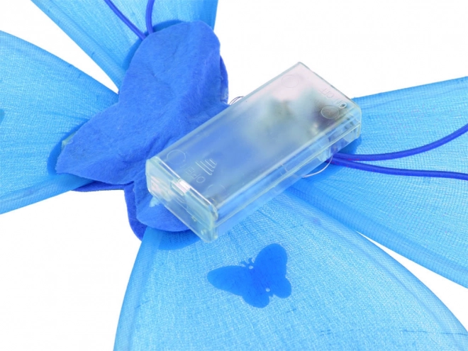 Lichtgevende blauwe kostuum voor een klein elfje met vlindervleugels
