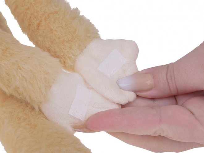 Hangende aap mascotte in beige kleur