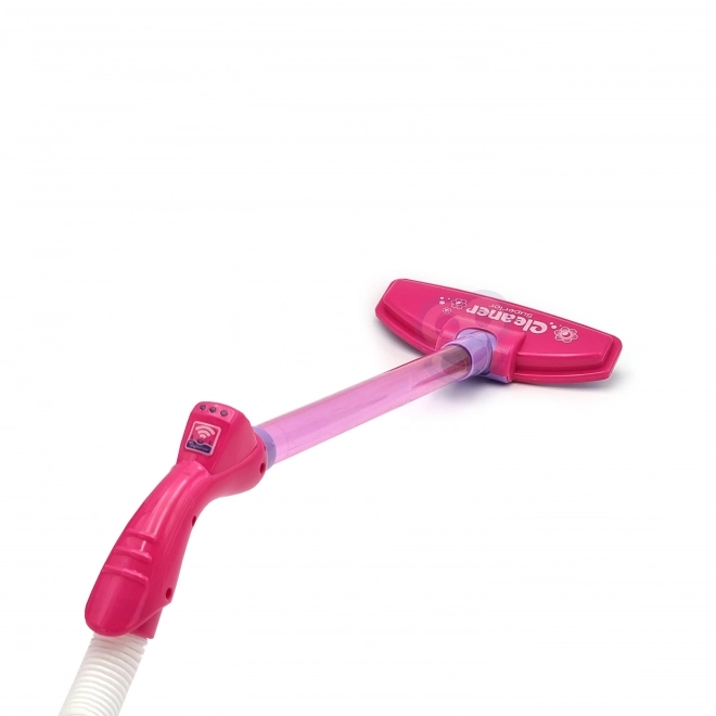 Roze kinderstofzuiger met zuigfunctie
