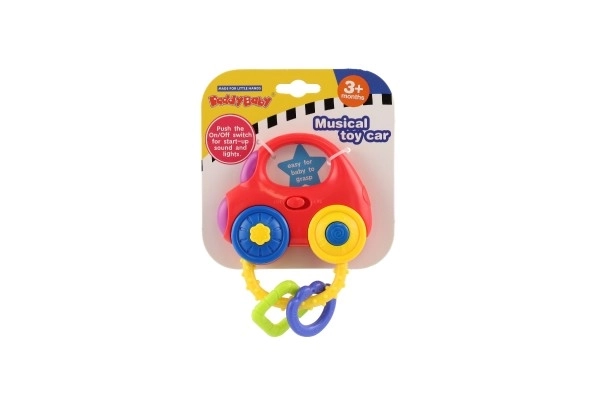 Rammelaar auto plastic 10x11cm op batterij met geluid en licht op kaart 3m+