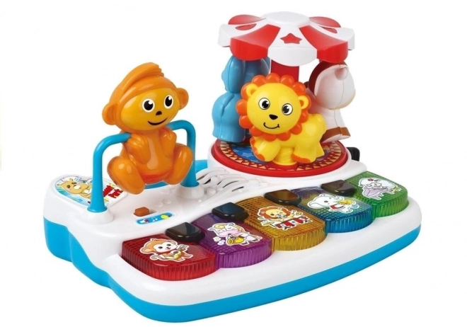 Pianinko met diertjes en draaimolen op de speelplaats