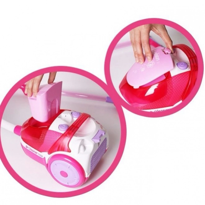 Roze kinderstofzuiger met zuigfunctie