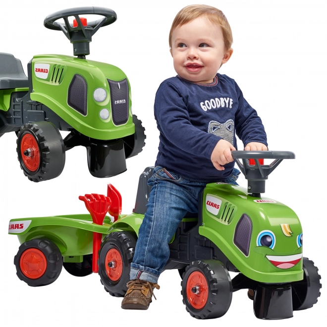 Duwtractor Claas groen met stuur en aanhanger