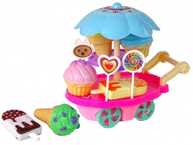 Kinderkraampje met speelgoed - ijscokar