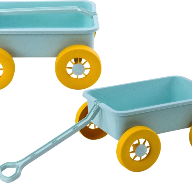 Pastelturquoise speelgoedkar voor in het zand