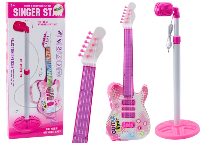 Roze elektrische kindergitaar met standaard en microfoon