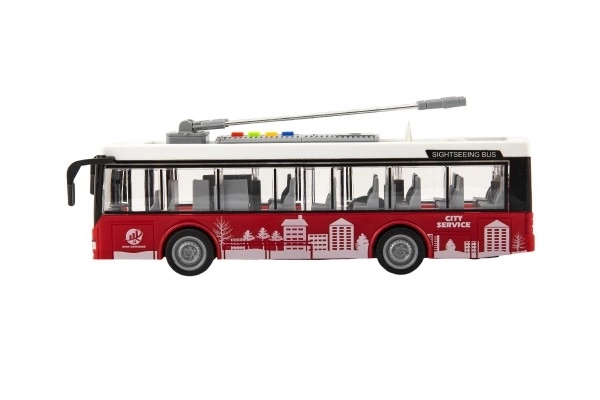 Bus/trolleybus kunststof 28cm met vliegwiel op batterij met licht en geluid in doos 32x17x11cm