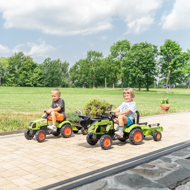 Trappertractor Claas Arion 410 met groene aanhanger