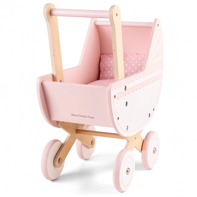 Roze houten poppenwagen met dekentje