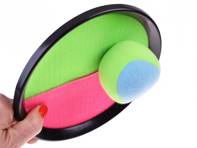 Spel met vangststokken en klittenbandballen