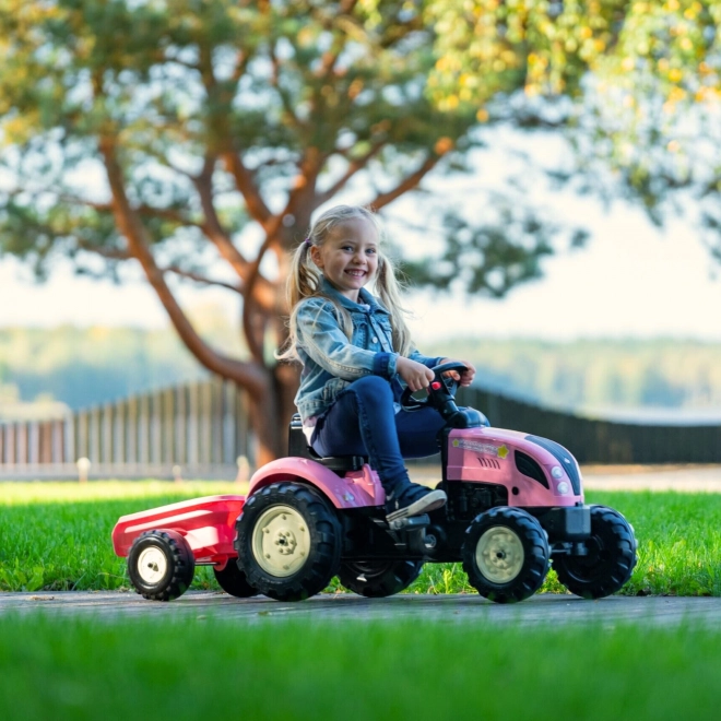Tractor trapauto County Star met roze aanhangwagen