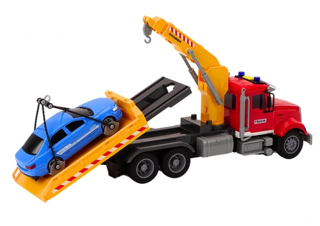 Rode sleepwagen met kraan en lichteffecten